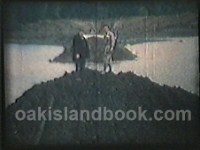 View from Earl Armstrong's Bulldozer pushing dirt on the causeway with James Troutman on the left, Jim Kaizer on the right
